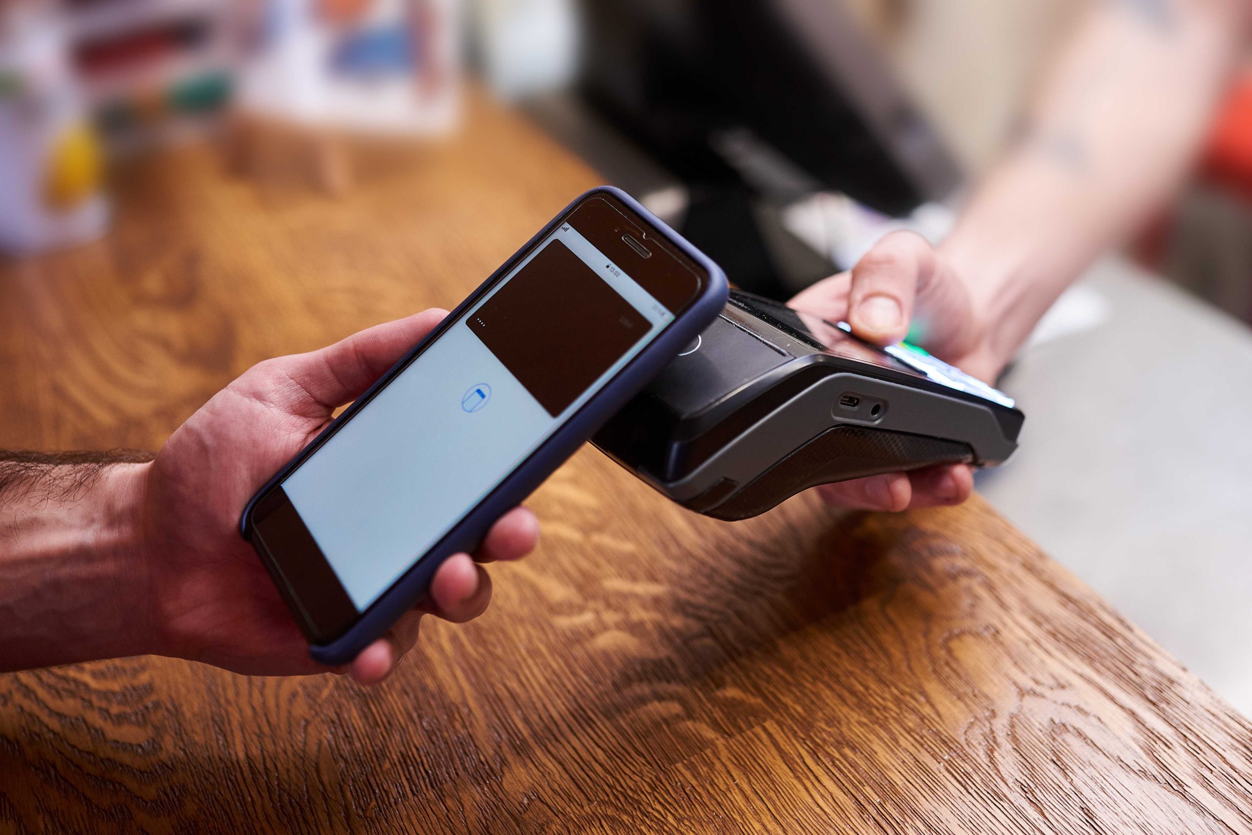 customer using tap to pay